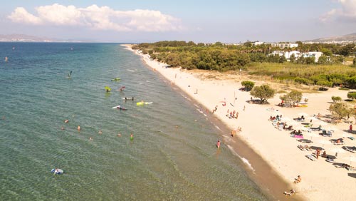 Explore the quiet beauty of Marmari as part of the family game. Drone view of Marmari beach, location of the family treasure hunt on Kos